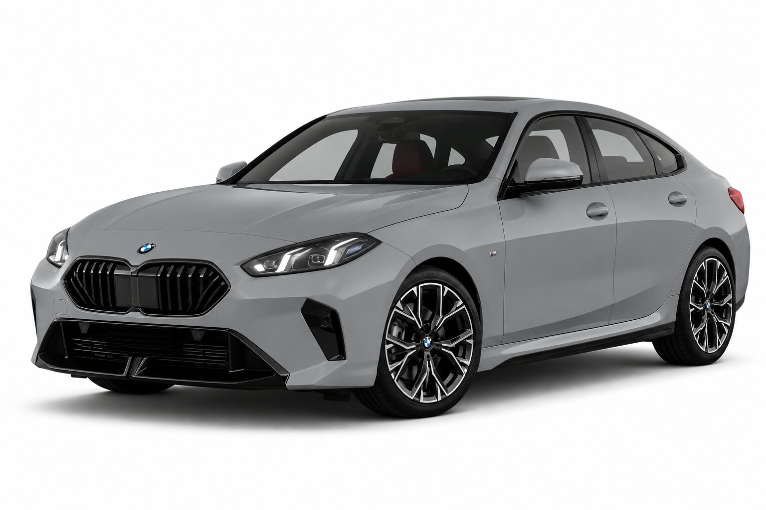 Gray BMW sedan shown from a front-right angle, with a sculpted hood, signature kidney grille and large multi-spoke wheels.