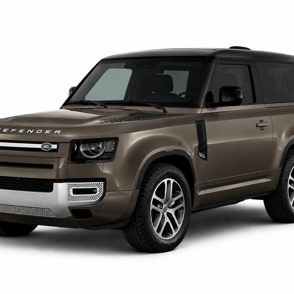 Bronze-brown Land Rover Defender SUV seen from front-left, with bold grille and black roof, large alloy wheels visible