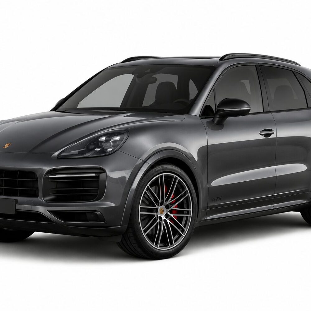 Gray Porsche SUV (Cayenne) in a three-quarter front view with a large black grille and sleek headlights, set on a white background.