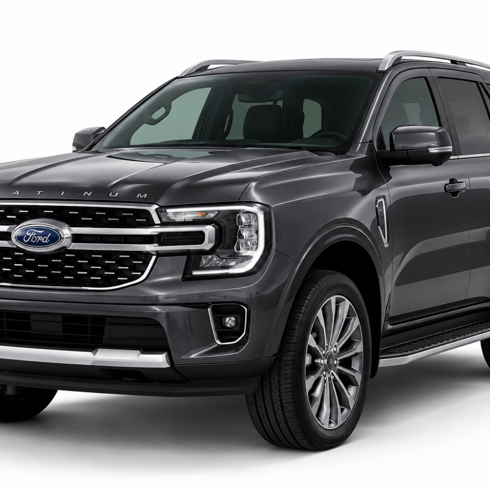 Dark gray Ford Platinum SUV, shown from a front three-quarter angle with chrome grille, large alloy wheels, and roof rails.