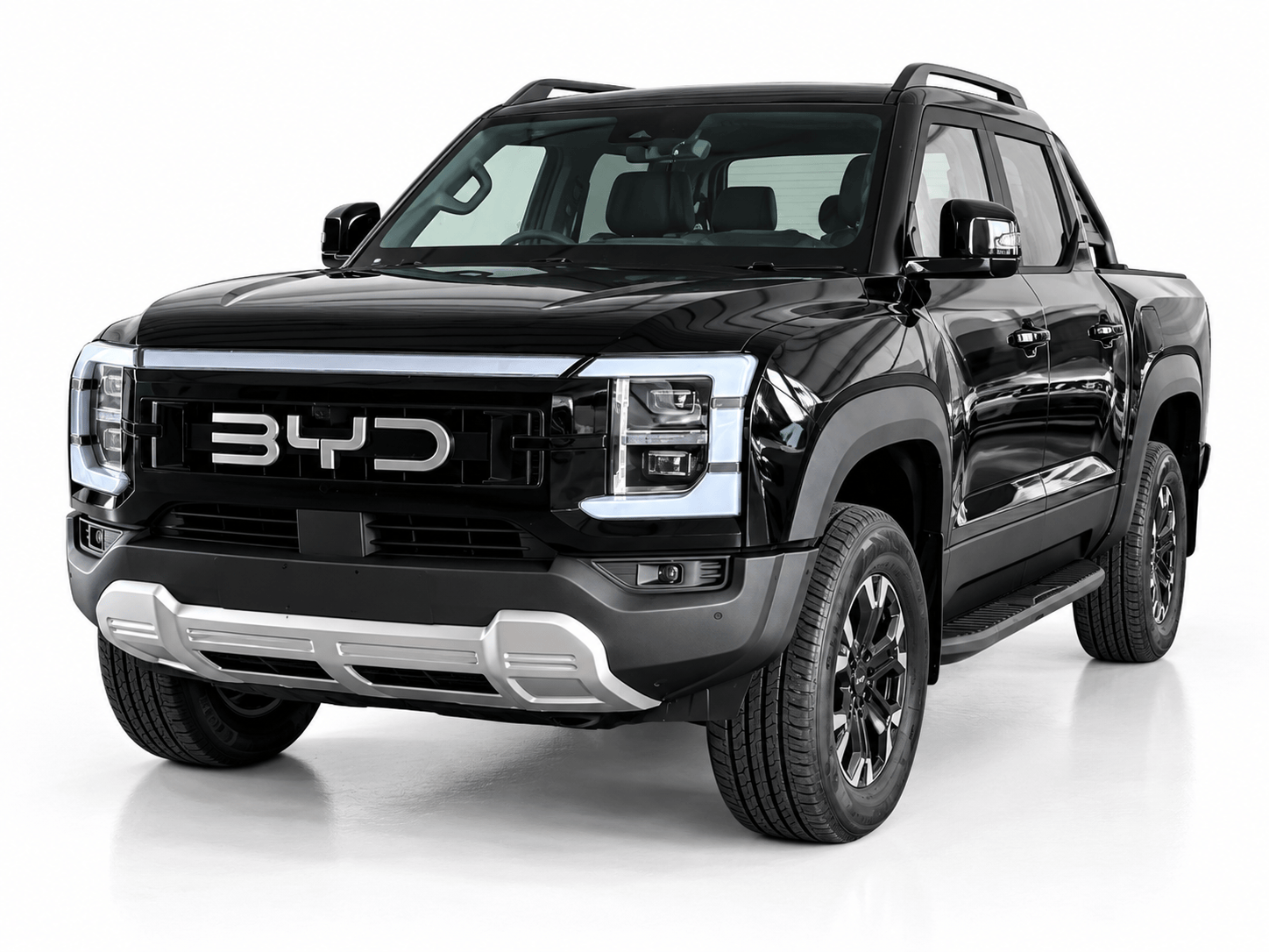 Front three-quarter view of a glossy black BYD pickup truck with a bold chrome grille and large off-road tires.