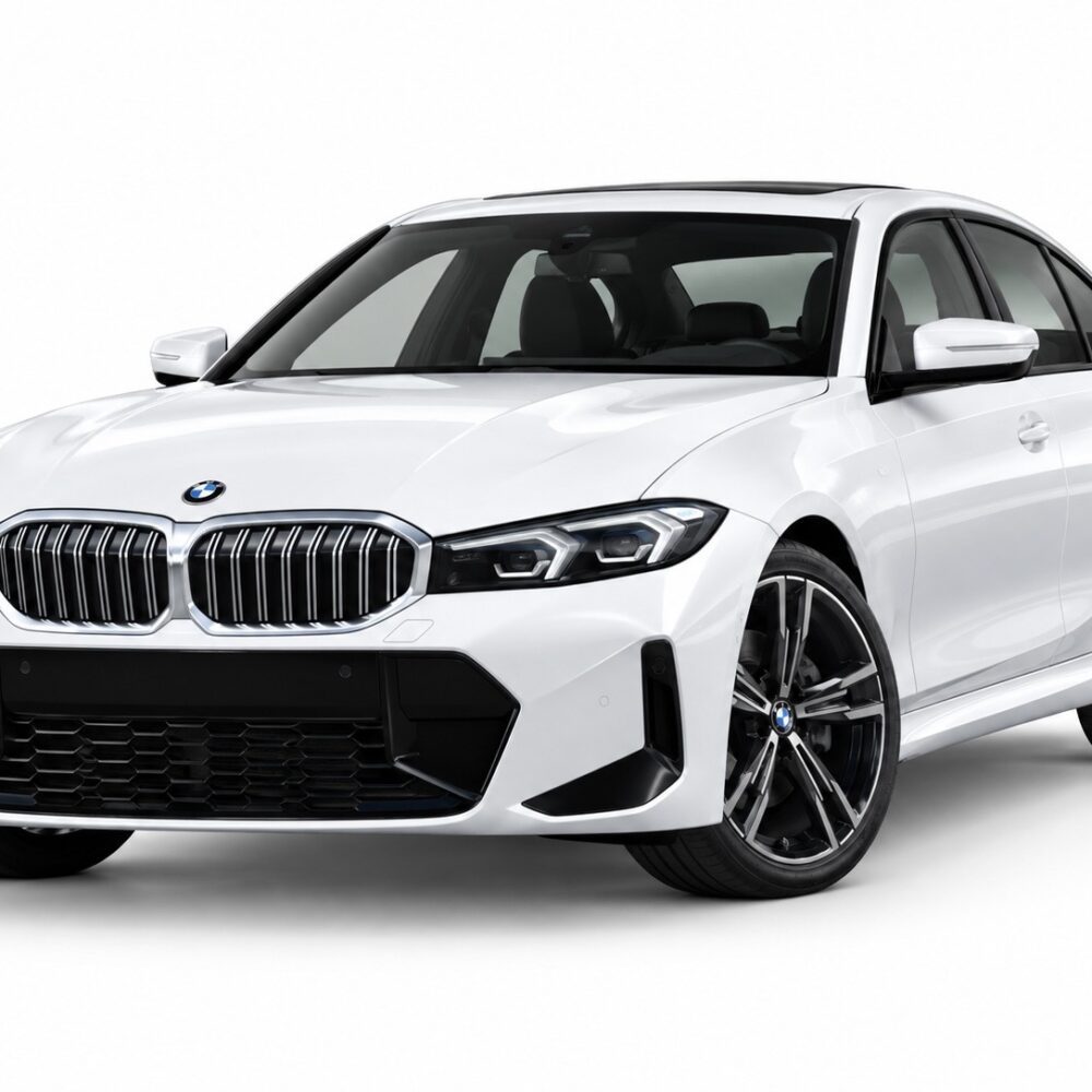 White BMW sedan shown from a front-right angle, highlighting the kidney grille and large lower grille openings.